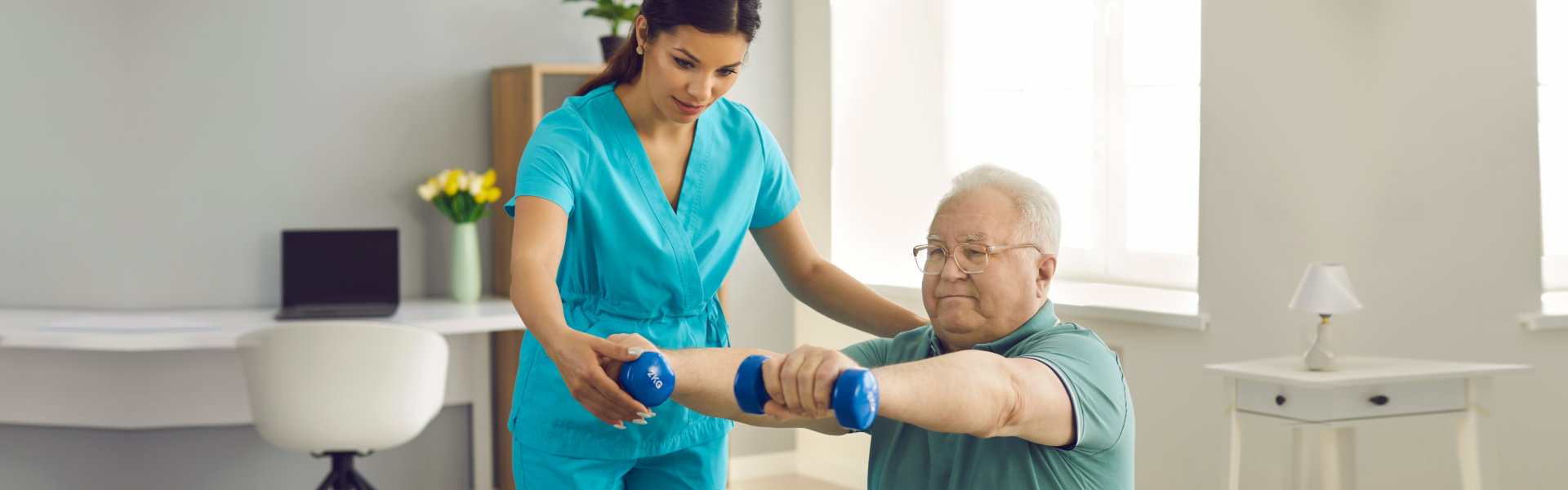 nurse assisting elderly man doing exercise