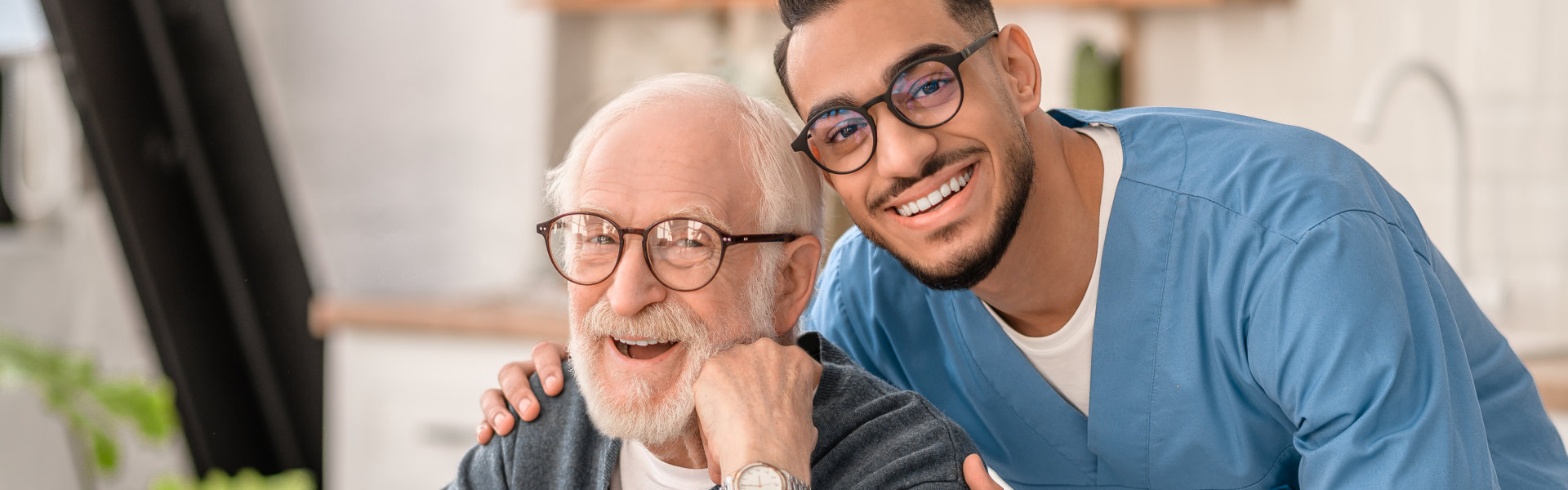 nurse and elderly man smiling